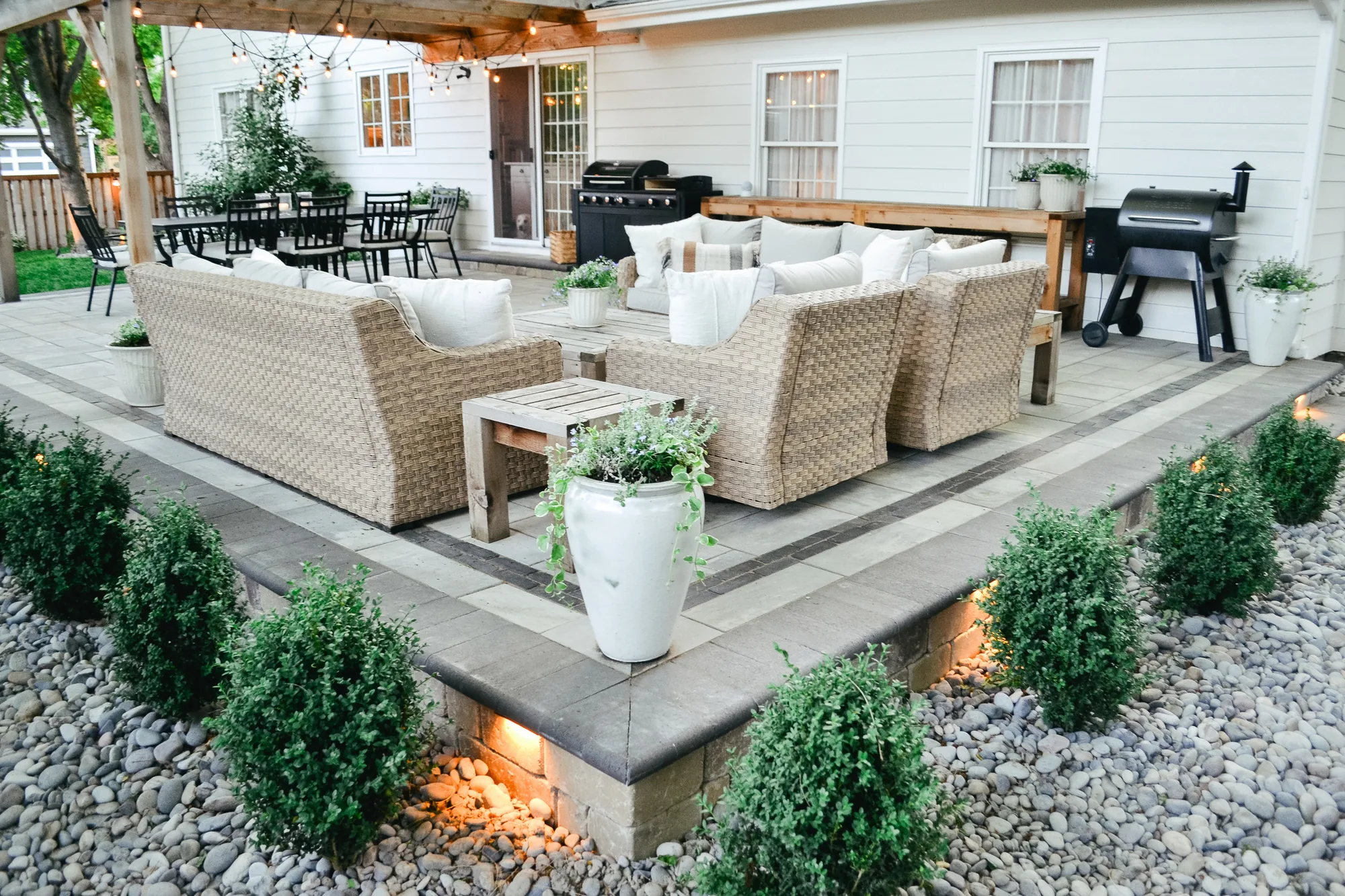 Raised dining terrace with integrated planting and fire
