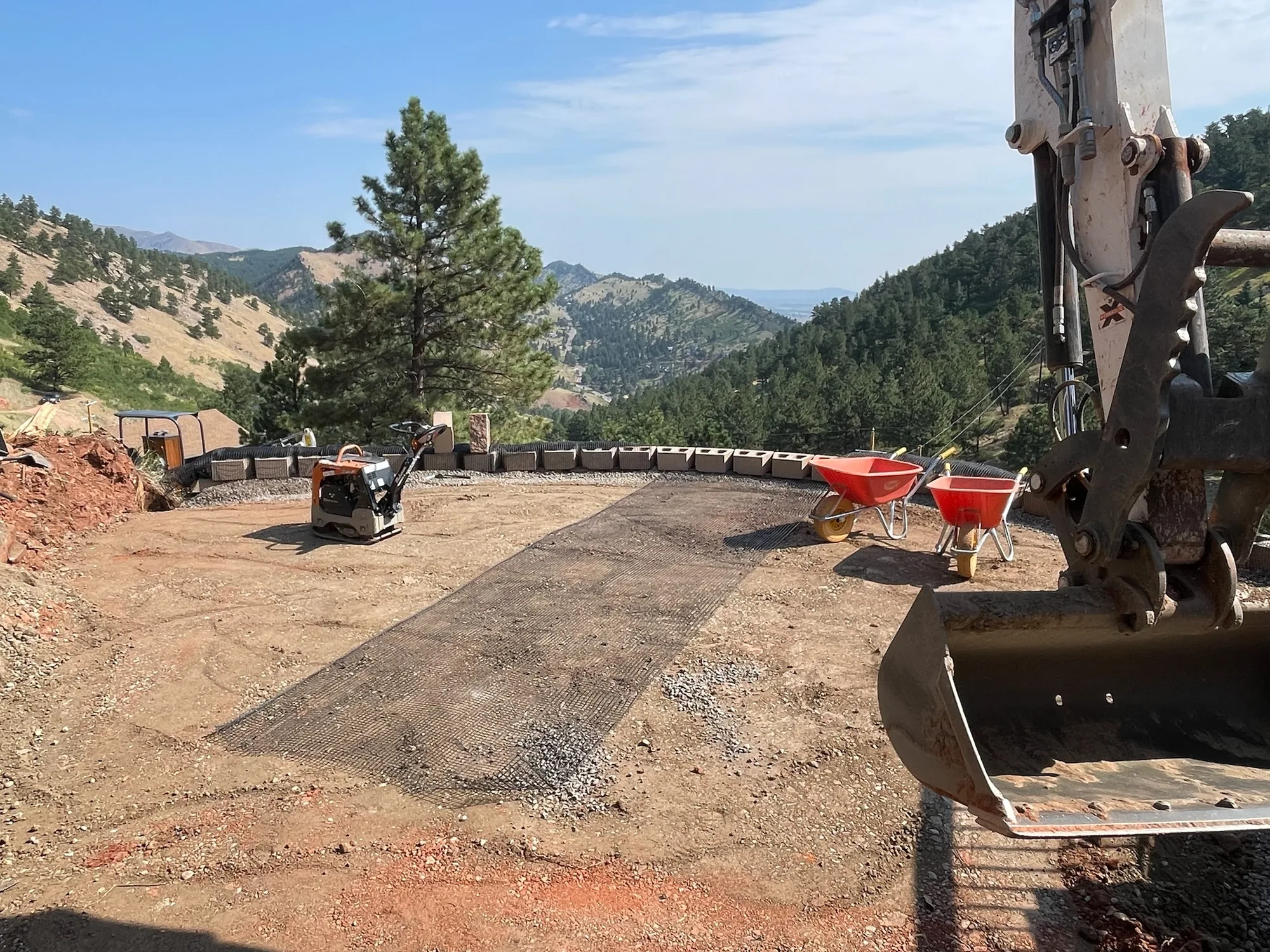 Compacted base course prepared for mountain site construction