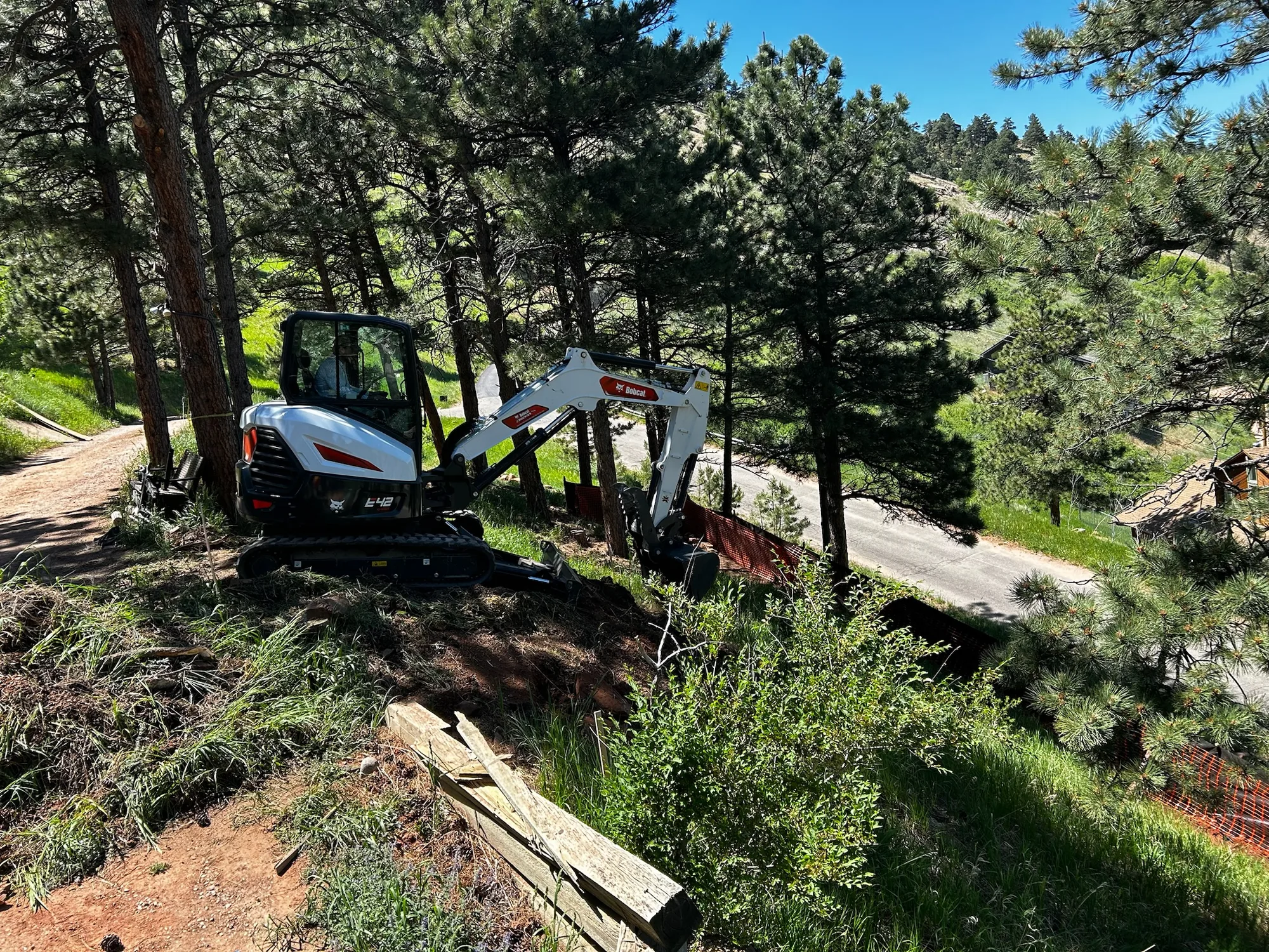 Equipment access through a wooded hillside site