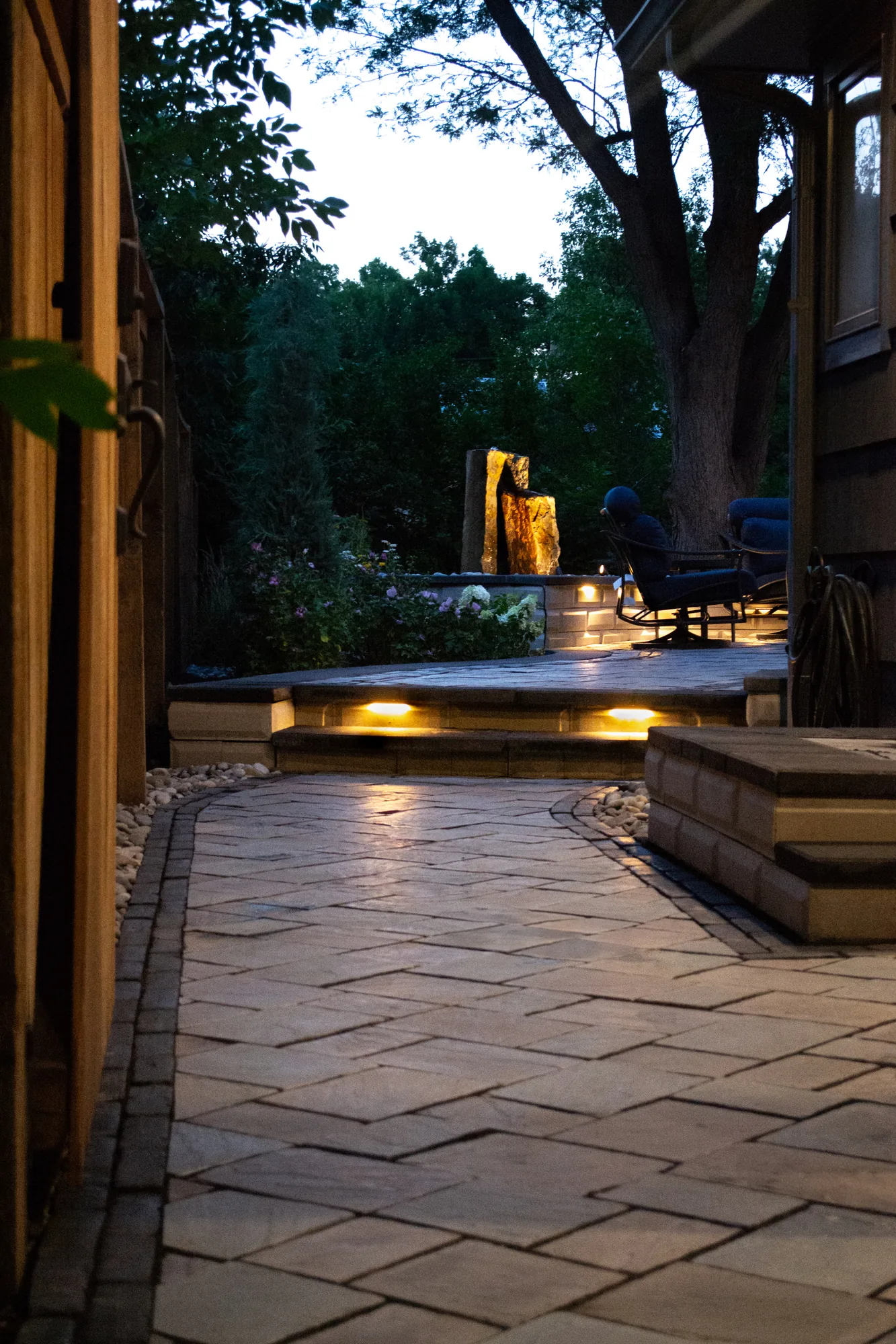 Water feature and pathway lighting at night