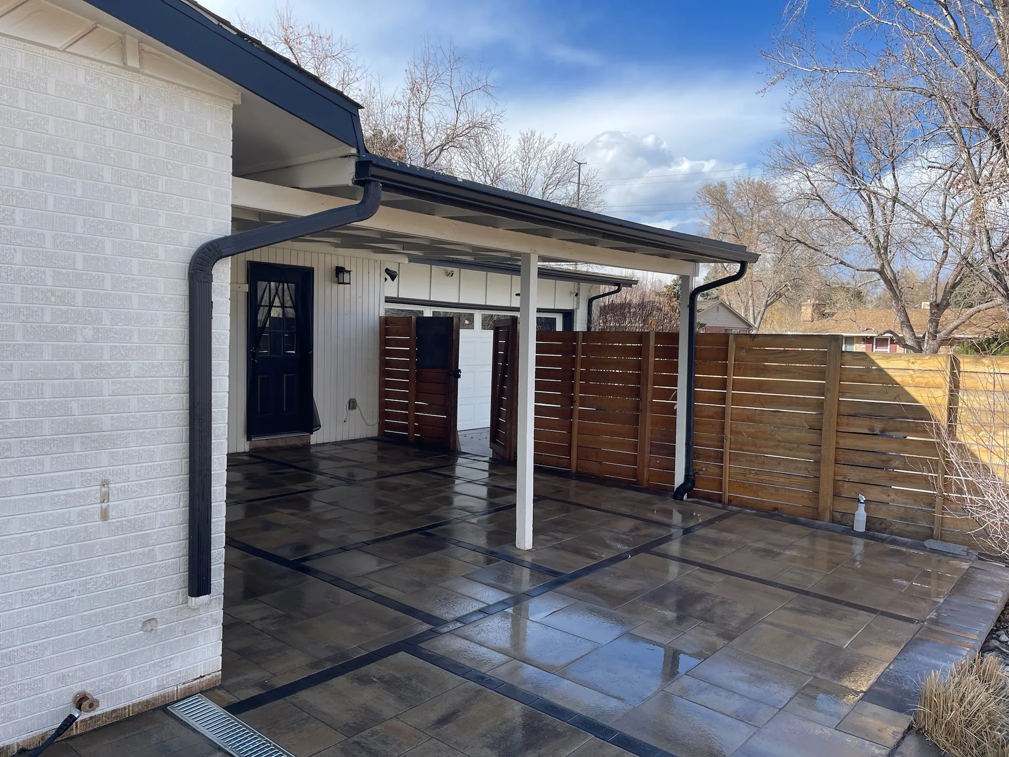 Finished covered patio with privacy fencing
