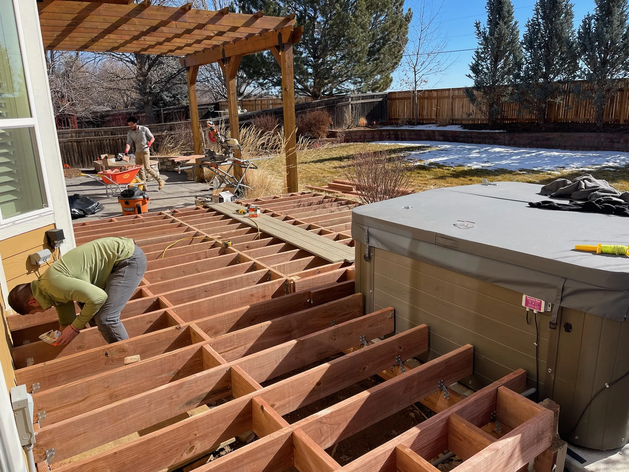Deck framing coordinated around an integrated spa