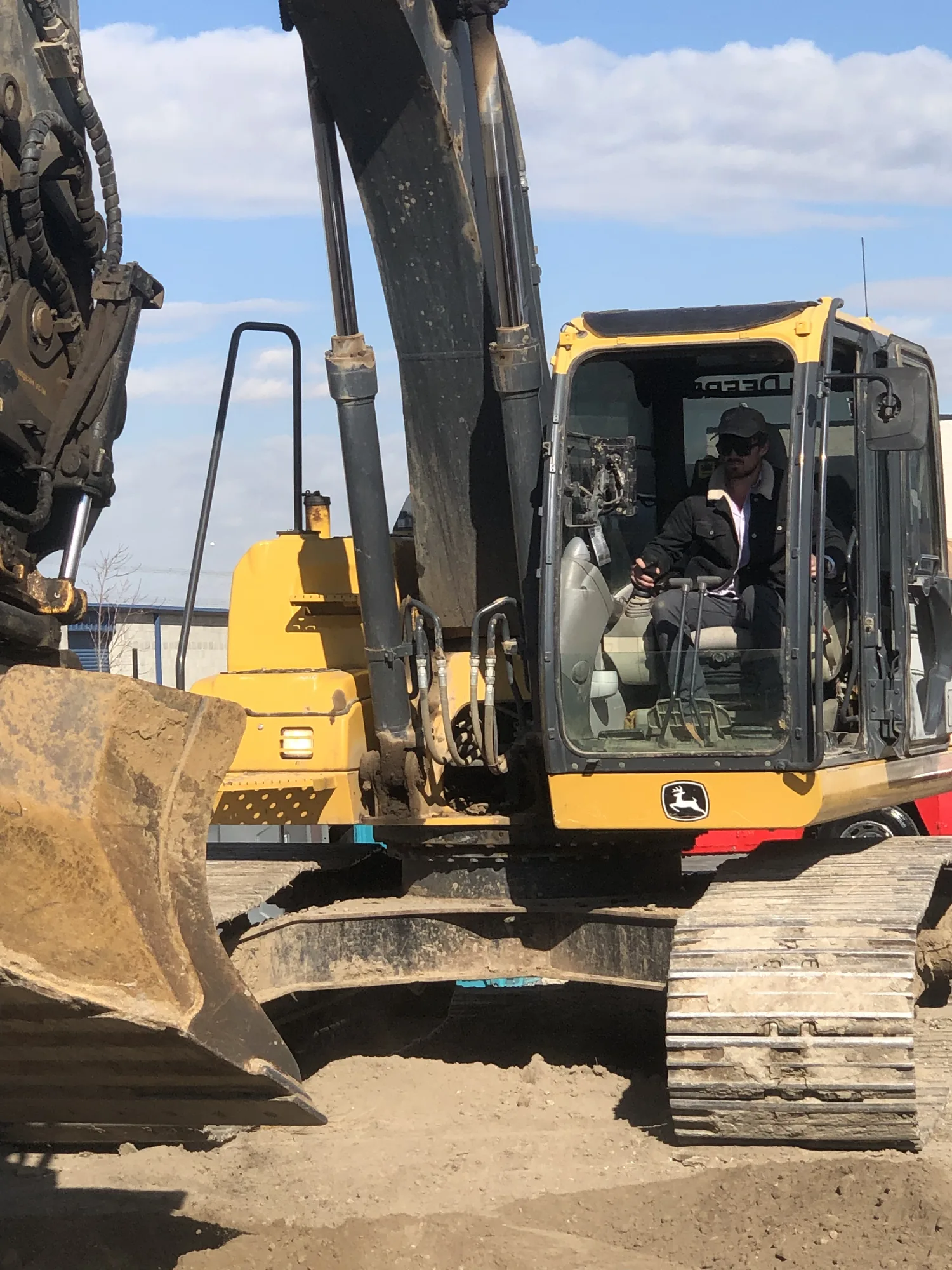 Operator working from a tracked excavator