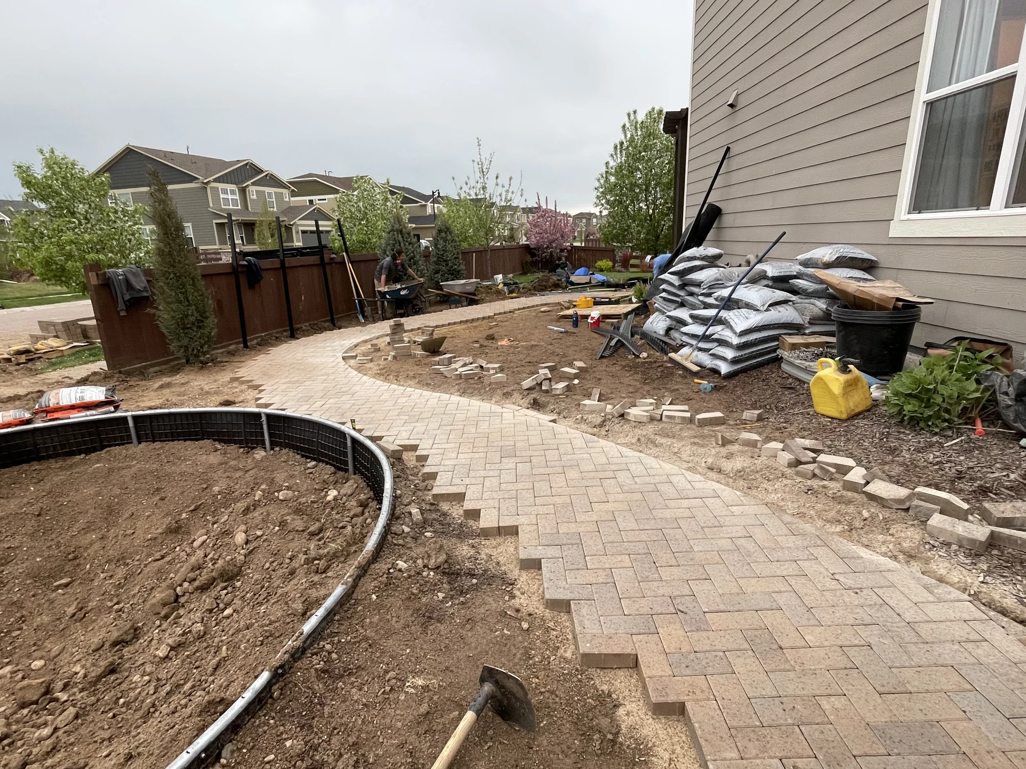 Curved paver walkway installation in progress