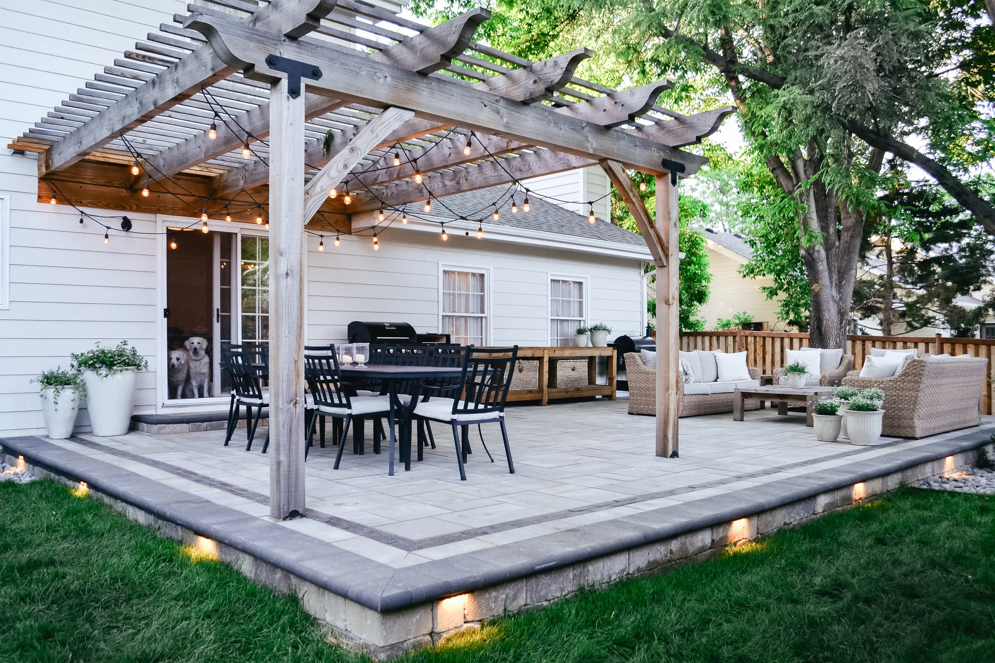 Completed Westchester outdoor living space with pergola, dining, and lounge areas