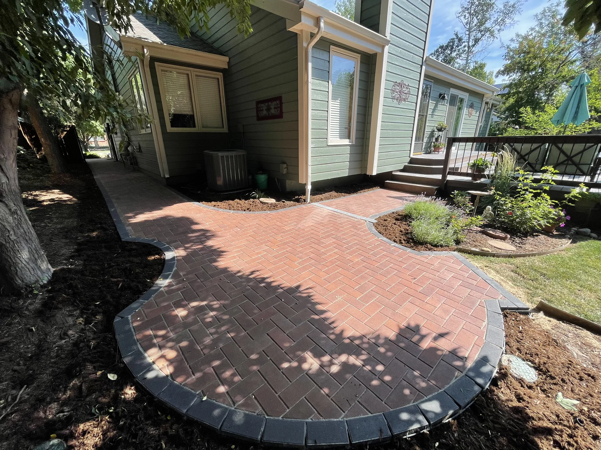 Completed curved brick patio and garden border