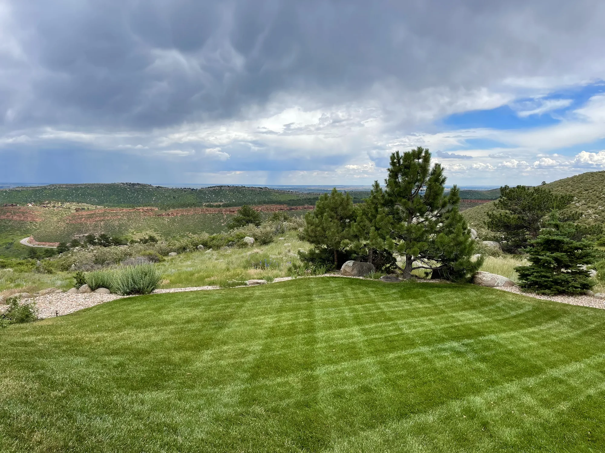 Finished lawn overlooking open foothill terrain