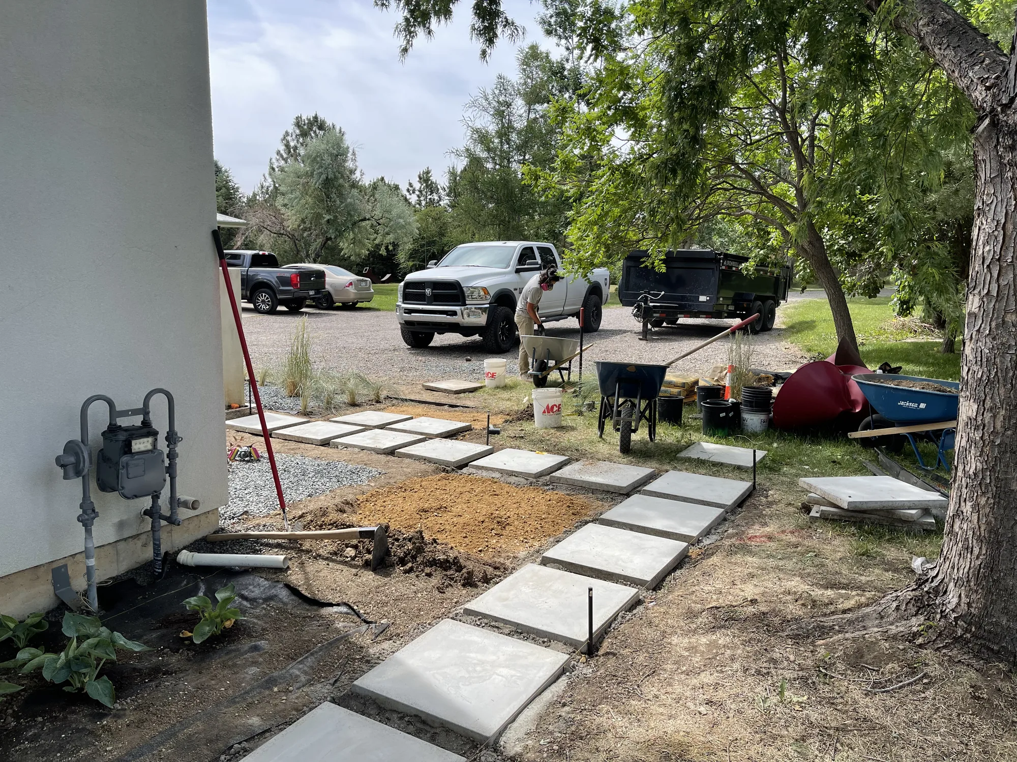 Stepping-stone walkway installation beside a residence