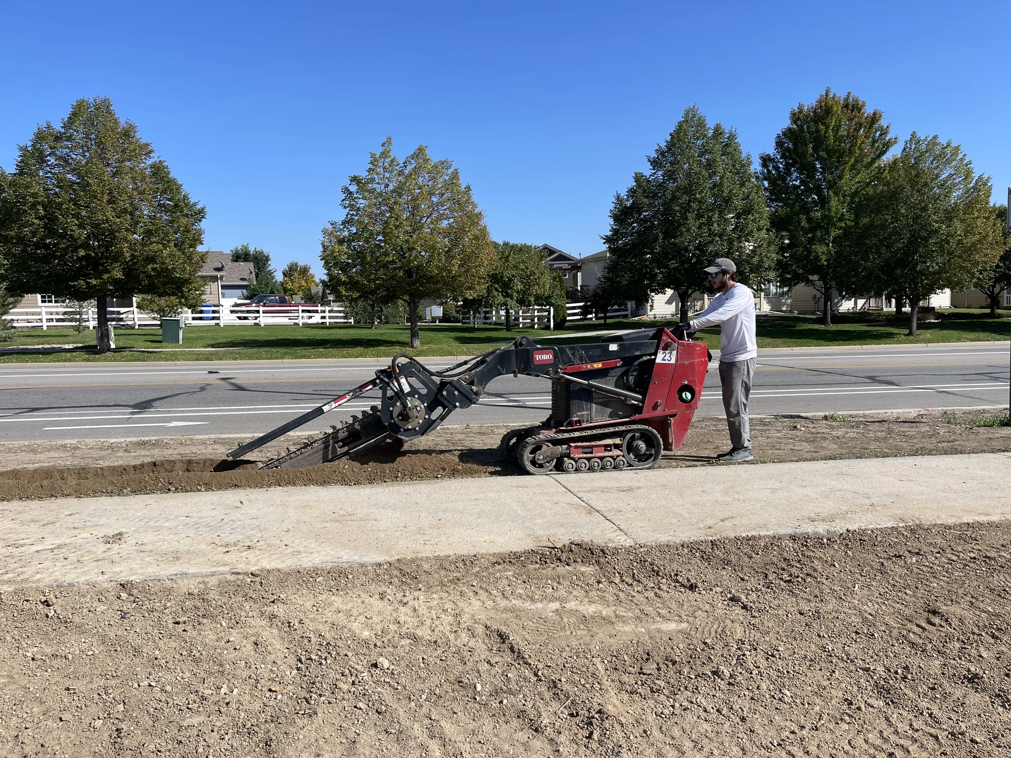 Power-rake grading during commercial site preparation