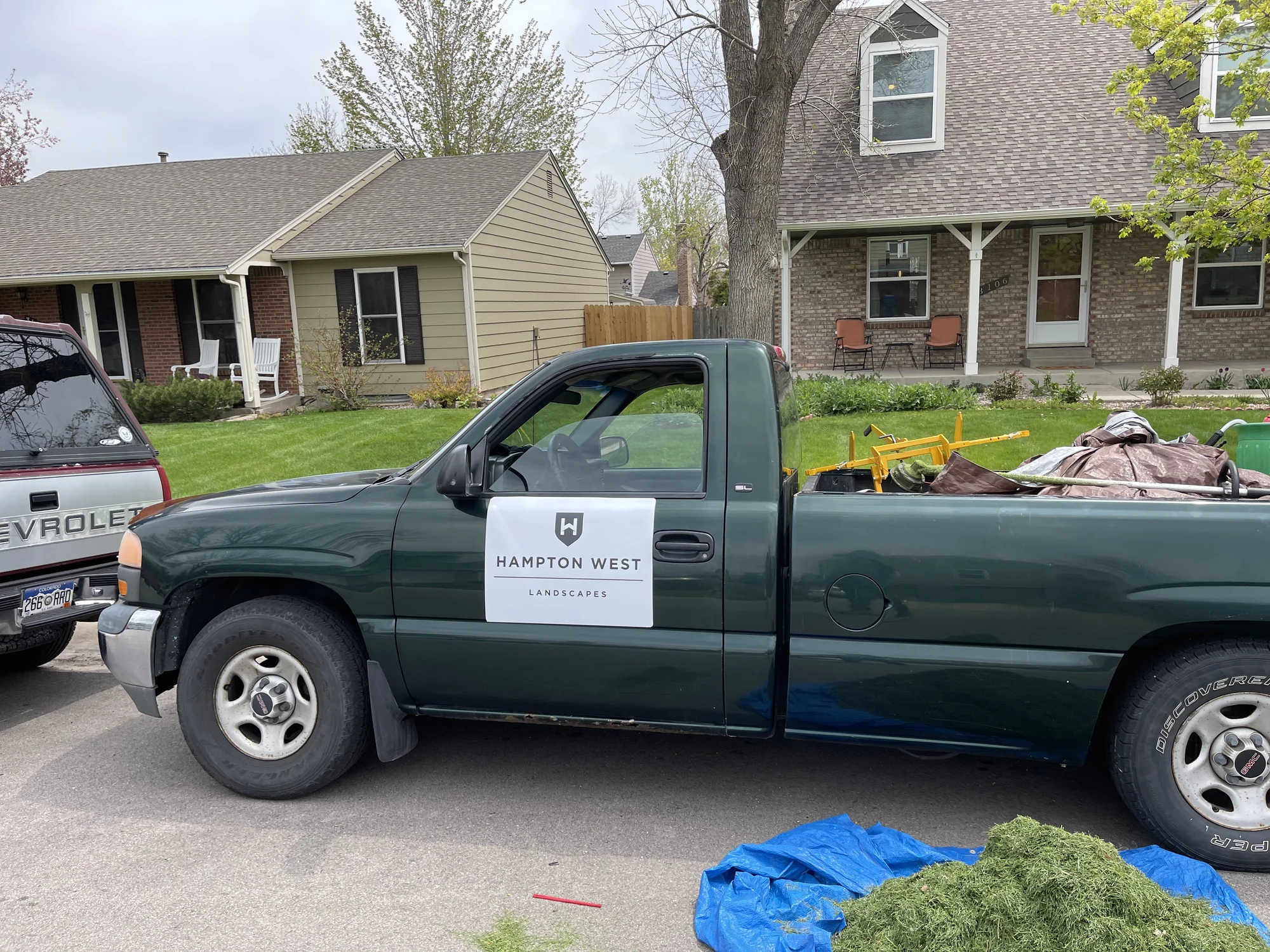 Original Hampton West landscape truck during a residential maintenance visit